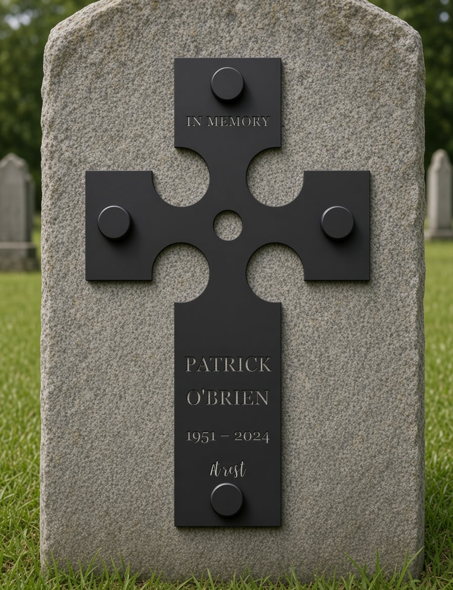 Celtic cross grave marker on black standoffs on a granite stone