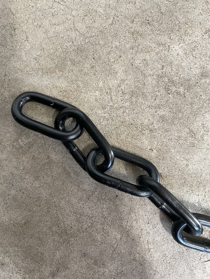 Close-up of 3/16 inch black heavy-duty chain links