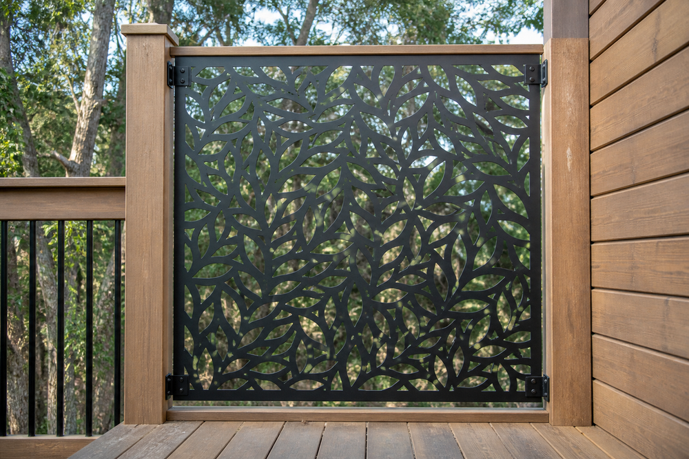 Overlapping leaf metal privacy panel on wood deck railing